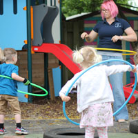 developing coordination and gross motor skills with hula-hoops