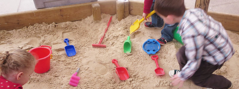 playing in the sand pit